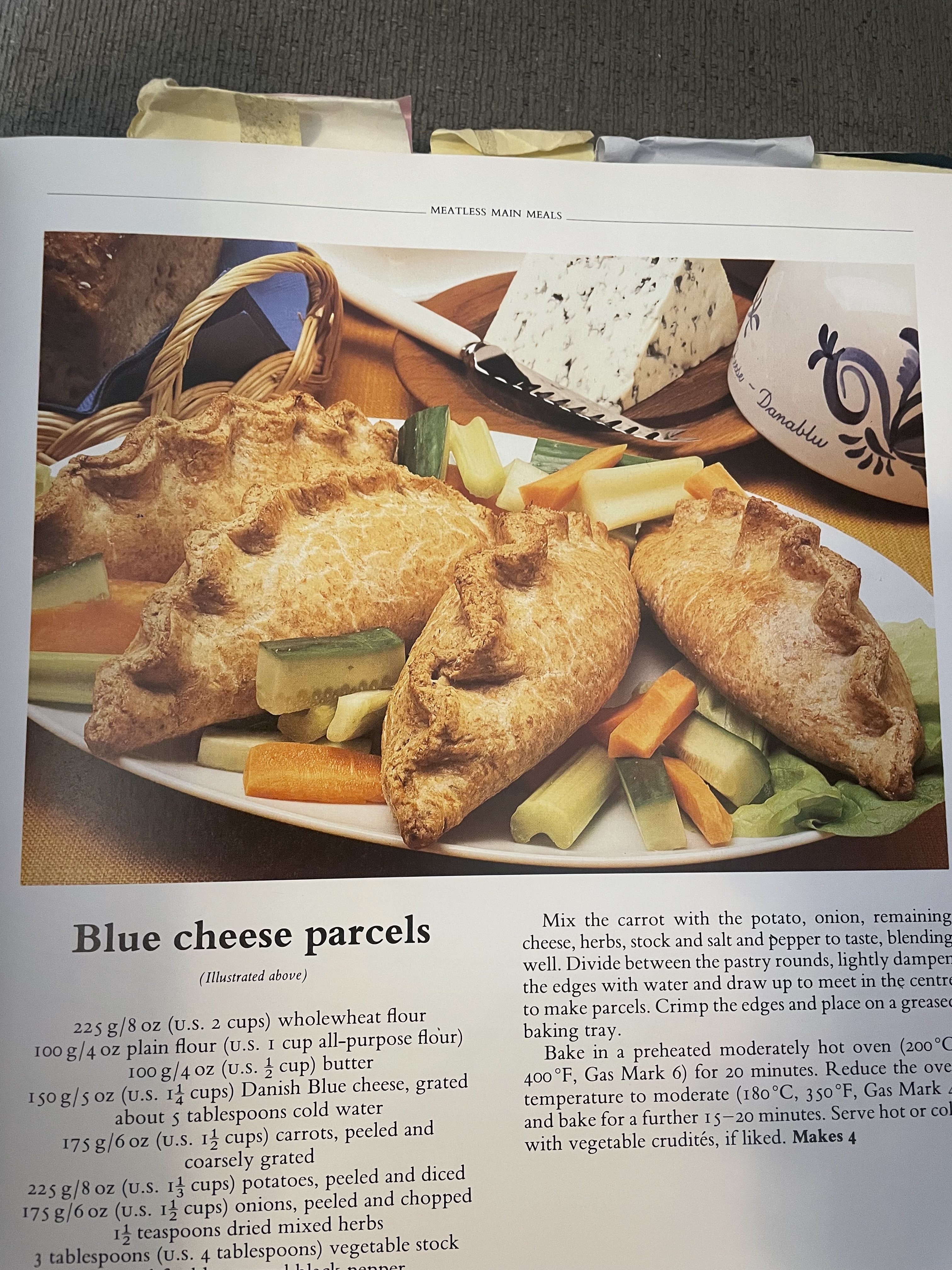 A cookbook photo of empanada-type food, with the title Blue Cheese Parcels